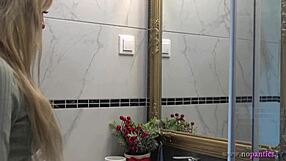 Hot blonde wife switches panties in bathroom. Her sexy legs steal the show!