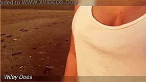 Flashing big tits outdoors at sunset, teasing passersby with nude exposure