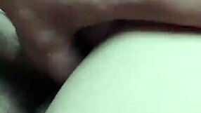 Young babe teases older man in the garage while on the phone.