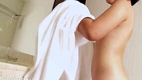 Small boobed Asian girl masturbates in the bathroom with a dildo