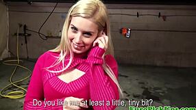 Cute picked up blonde flashes camera outdoors.