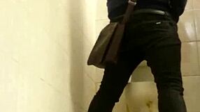 Two guys engage in intense gay action inside public toilet