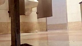 Two guys engage in intense gay action inside public toilet