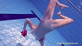 Proklova strips her bikini and goes for a swim in the pool.