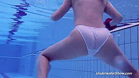 Proklova removes bikini for underwater swim in pool bathing scene