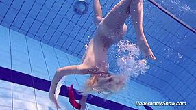 Proklova removes bikini for underwater swim in pool bathing scene