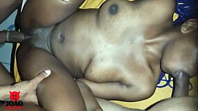 Black beauty gets double satisfaction by sucking and fucking two cocks