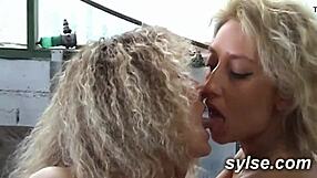 Two amateur MILFs in the garage exhibition with mechanic