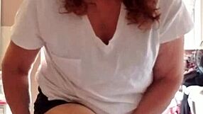 she applies lotion to her mature skin.