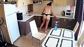 big tits beauty cleans kitchen