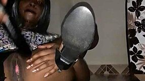 Ebony milf squirts hard from eggplant play on the floor