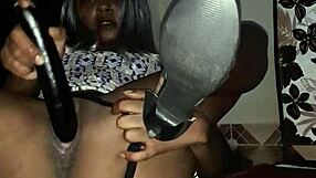 Ebony milf squirts hard from eggplant play on the floor