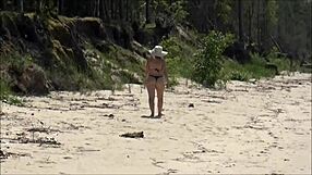 Milf relaxes on sunny beach