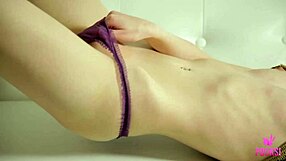 Does Liz stimulate her clit on the sofa?