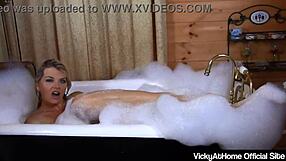 Horny blonde Vicky Vette enjoys sexy bubble bath while masturbating