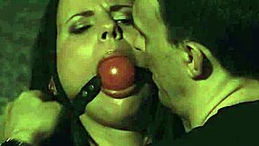 ballgagged damsel endures leather bondage and rough punishment