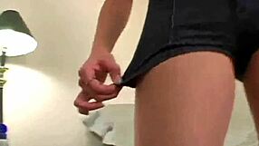 A beautiful blonde teenage girl gives a hand job with a striptease
