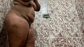 This sexy girl is shaking her big ass in the shower so nicely