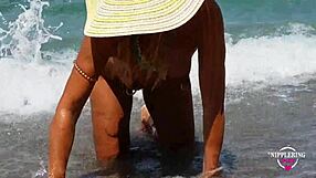 nippleringlover shows huge pussy piercings on nude beach