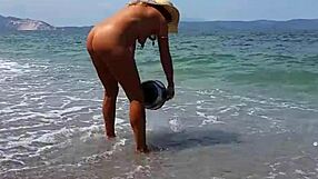 nippleringlover shows huge pussy piercings on nude beach