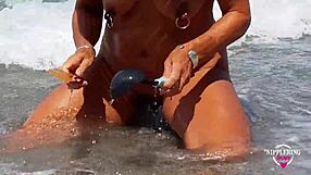 nippleringlover shows huge pussy piercings on nude beach