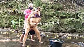 Pinay Ganda bent over in public river, getting doggystyle creampie from horny guy