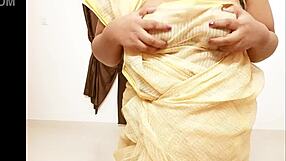 Look at this chubby Asian aunt showing her big tits and boobs.