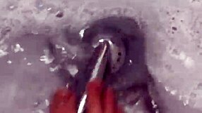 Nylon removal leads to a steamy shower scene with feet.