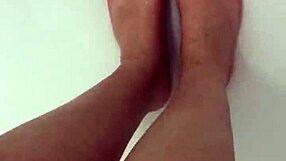 Nylon removal leads to a steamy shower scene with feet.