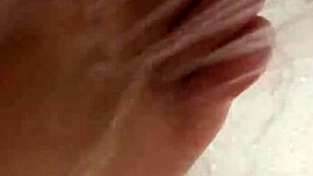 Nylon removal leads to a steamy shower scene with feet.