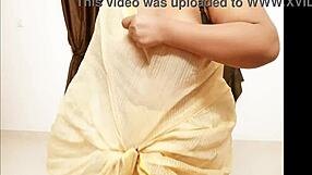 Look at this chubby Asian aunt showing her big tits and boobs.