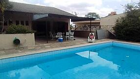 athletic milf enjoys a refreshing pool swim with a tasty treat