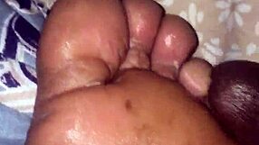 my girlfriend gives me a footjob in the bedroom