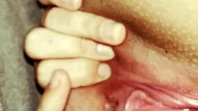 She stretches her fat pussy under covers for clit orgasm.