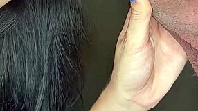 Close up of a sexy blonde’s blue nails and red lips while she gives a blowjob
