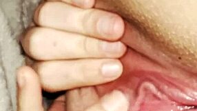 She stretches her fat pussy under covers for clit orgasm.