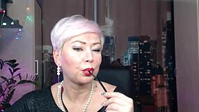 Juicy Russian MILF AimeeParadise performs an immodest striptease dance in sexy stockings, showcasing her big tits