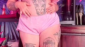 Teasing in silk pajamas with a curvy figure