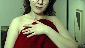 Brunette camgirl oils her huge tits