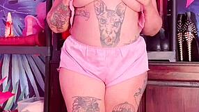 Teasing in silk pajamas with a curvy figure