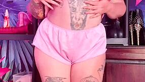 Teasing in silk pajamas with a curvy figure