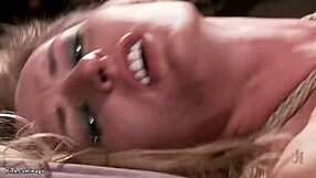 Slim blond in bondage gets rough handling