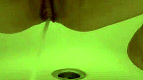 Gorgeous beauty gets soft cunt filled with warm pee