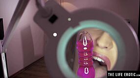 big-titted beauty studies her hairy pussy with a magnifying glass