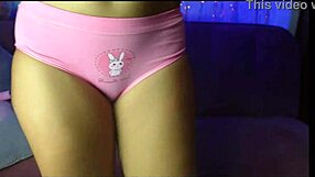 Latina babe soaks her pink jeans with big tits bouncing wildly