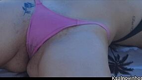 Check this wife asking the vendor to rub sunscreen on her skinny beach bum. What a sneaky flash!