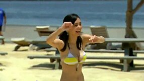 a cute japanese girl in a bikini shows off her big tits