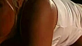 Slut in white lingerie sucks on beaver while getting pissed on