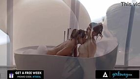 Lesbians enjoy a romantic bath with mutual masturbation