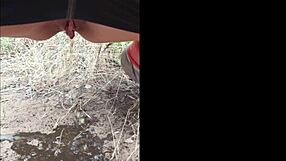 Sofie Marie's natural tits get pissed on outdoors – kinky milf contrast.